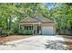 Charming single-Gathering home featuring a cozy front porch, well-maintained lawn, and attached one car garage at 1453 Joy Ave, Charleston, SC 29407