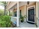 Charming home featuring a cozy front porch and black front door at 1453 Joy Ave, Charleston, SC 29407