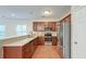 Kitchen with stainless steel appliances, hardwood floors and stone countertops at 1453 Joy Ave, Charleston, SC 29407