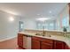 Open kitchen with bar seating, stainless steel appliances, and a seamless flow into the living area at 1453 Joy Ave, Charleston, SC 29407