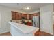 Kitchen with stainless steel appliances, hardwood floors and stone countertops at 1453 Joy Ave, Charleston, SC 29407