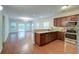 An open kitchen and living room area with hardwood floors at 1453 Joy Ave, Charleston, SC 29407