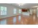 Spacious open-concept living area with hardwood floors, abundant natural light, and seamless kitchen access at 1453 Joy Ave, Charleston, SC 29407