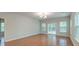 Bright living room featuring hardwood floors, ample natural light, and a sliding door that leads outside at 1453 Joy Ave, Charleston, SC 29407
