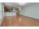 Open-concept living area showcasing hardwood floors, a kitchen bar, and plenty of space for entertaining at 1453 Joy Ave, Charleston, SC 29407