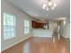 Open concept living space with hardwood floors and an adjacent kitchen at 1453 Joy Ave, Charleston, SC 29407