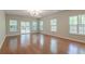 Bright living room with hardwood floors and glass patio doors at 1453 Joy Ave, Charleston, SC 29407