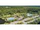 Aerial shot showcasing pools, playground, and amenities within a leafy, well-maintained community at 1535 Capel St, Mount Pleasant, SC 29466