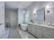 Light and airy bathroom with floral wallpaper, marble floors, and a freestanding tub at 1535 Capel St, Mount Pleasant, SC 29466