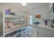 bedroom features a bunk bed, white dresser, colorful rug and door leading to the outside at 1535 Capel St, Mount Pleasant, SC 29466