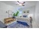 Stylish bedroom showcasing a cozy bed, blue patterned wallpaper, and a tranquil ambiance at 1535 Capel St, Mount Pleasant, SC 29466