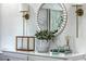 Stylized console table featuring decorative accents, lamps and a beaded mirror at 1535 Capel St, Mount Pleasant, SC 29466