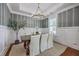 Dining room featuring elegant wallpaper, modern chandelier, and seating for six at 1535 Capel St, Mount Pleasant, SC 29466