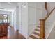 Inviting foyer with hardwood floors, paneled walls, and staircase leading to the upper level at 1535 Capel St, Mount Pleasant, SC 29466