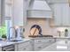 Clean and modern kitchen with white cabinets, quartz countertops, and stainless steel appliances at 1535 Capel St, Mount Pleasant, SC 29466