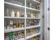 Organized pantry with open shelving and clear storage containers for food items at 1535 Capel St, Mount Pleasant, SC 29466
