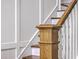 Close-up on a stair railing and post showcasing the craftsmanship and bright design of the home at 1535 Capel St, Mount Pleasant, SC 29466