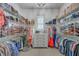 Bright walk-in closet featuring custom shelving and drawers, offering ample storage space for clothes and accessories at 1535 Capel St, Mount Pleasant, SC 29466