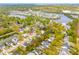 Stunning aerial view of a residential neighborhood with lush landscaping and a picturesque lake at 1543 Gemstone Dr, Mount Pleasant, SC 29464