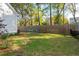 Well-maintained backyard with lush grass, wooden fencing, and outdoor play equipment at 1543 Gemstone Dr, Mount Pleasant, SC 29464