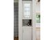 Wet bar with glass shelving and wine storage within easy reach of the kitchen and dining room at 1543 Gemstone Dr, Mount Pleasant, SC 29464