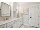 Bathroom with double vanity, white cabinets, and neutral paint at 1543 Gemstone Dr, Mount Pleasant, SC 29464