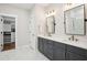 Bathroom with dual vanities, modern fixtures, gray cabinets and marble floors at 1543 Gemstone Dr, Mount Pleasant, SC 29464
