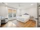 Sunlit bedroom showcasing a neutral color scheme, hardwood floors, and a cozy reading nook at 1543 Gemstone Dr, Mount Pleasant, SC 29464