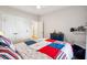 Bedroom featuring white walls, wood floors, ceiling fan, and a colorful patchwork quilt at 1543 Gemstone Dr, Mount Pleasant, SC 29464