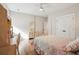 Bedroom with a four-post bed frame, ceiling fan, and a dresser and desk at 1543 Gemstone Dr, Mount Pleasant, SC 29464