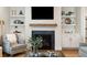 Elegant fireplace flanked by built-in shelves, perfect for displaying decor, and creating a focal point in the room at 1543 Gemstone Dr, Mount Pleasant, SC 29464