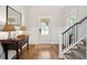 Bright foyer with hardwood floors, staircase, console table, and natural light at 1543 Gemstone Dr, Mount Pleasant, SC 29464