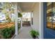 Charming covered porch with swing and decorative plants at 1543 Gemstone Dr, Mount Pleasant, SC 29464