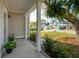 Inviting covered porch with brick flooring, plants, and neighborhood views at 1543 Gemstone Dr, Mount Pleasant, SC 29464