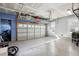 Well lit garage with an epoxy floor and overhead storage racks at 1543 Gemstone Dr, Mount Pleasant, SC 29464