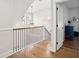 Upstairs hallway featuring hardwood floors, iron railings and pendant lighting at 1543 Gemstone Dr, Mount Pleasant, SC 29464