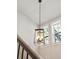 Hallway featuring a modern pendant light fixture and plenty of natural light at 1543 Gemstone Dr, Mount Pleasant, SC 29464