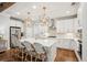 Modern kitchen featuring an island with seating, stainless steel appliances, and ample lighting at 1543 Gemstone Dr, Mount Pleasant, SC 29464