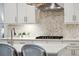 Close up of kitchen featuring decorative backsplash, cooktop, and stainless steel range hood at 1543 Gemstone Dr, Mount Pleasant, SC 29464