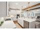 Bright, open kitchen with white cabinetry, an island with a farmhouse sink, and modern appliances at 1543 Gemstone Dr, Mount Pleasant, SC 29464