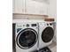 Laundry room with a washer and dryer and storage cabinets above them at 1543 Gemstone Dr, Mount Pleasant, SC 29464