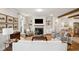 Inviting living room with a fireplace, TV, exposed wooden beams, and neutral decor providing a relaxed atmosphere at 1543 Gemstone Dr, Mount Pleasant, SC 29464
