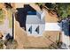 Bird's eye view of a grey roofed home on a manicured lot with a concrete driveway at 1577 Periwinkle Dr, Mount Pleasant, SC 29466