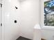 Modern shower with white subway tile, black fixtures, and a sleek design, creating a clean and stylish look at 1577 Periwinkle Dr, Mount Pleasant, SC 29466