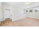 Bright bonus room with wood floors, plenty of natural light, and neutral paint, perfect for relaxation at 1577 Periwinkle Dr, Mount Pleasant, SC 29466