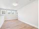 Bonus room with wood flooring, natural light from the windows, and neutral paint, ideal for customization at 1577 Periwinkle Dr, Mount Pleasant, SC 29466