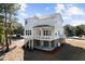 A two-story house with white siding and a covered porch, sitting on a well-maintained lot at 1577 Periwinkle Dr, Mount Pleasant, SC 29466
