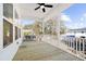 Relaxing porch with a ceiling fan provides ample space for outdoor seating at 1577 Periwinkle Dr, Mount Pleasant, SC 29466