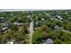 Overhead aerial view of the property with beach access, surrounded by lush greenery, charming homes, and a quiet road at 17 24Th Ave, Isle of Palms, SC 29451