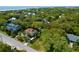 Stunning aerial view of the property with a pool and beach access, surrounded by lush greenery and charming homes at 17 24Th Ave, Isle of Palms, SC 29451